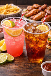 Iced pink and brown drinks with lemon and lime