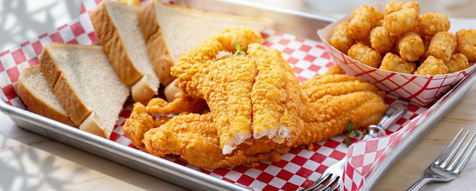 Crispy golden fried fish fillets with bread