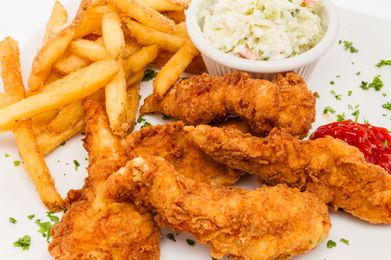 Crispy chicken tenders, french fries, and coleslaw
