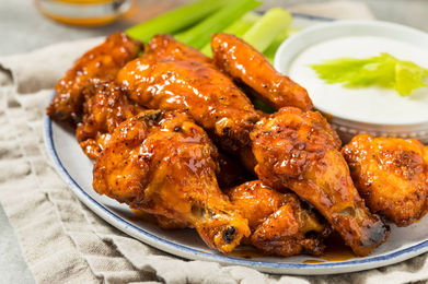 Buffalo wings, celery sticks, and dipping sauce